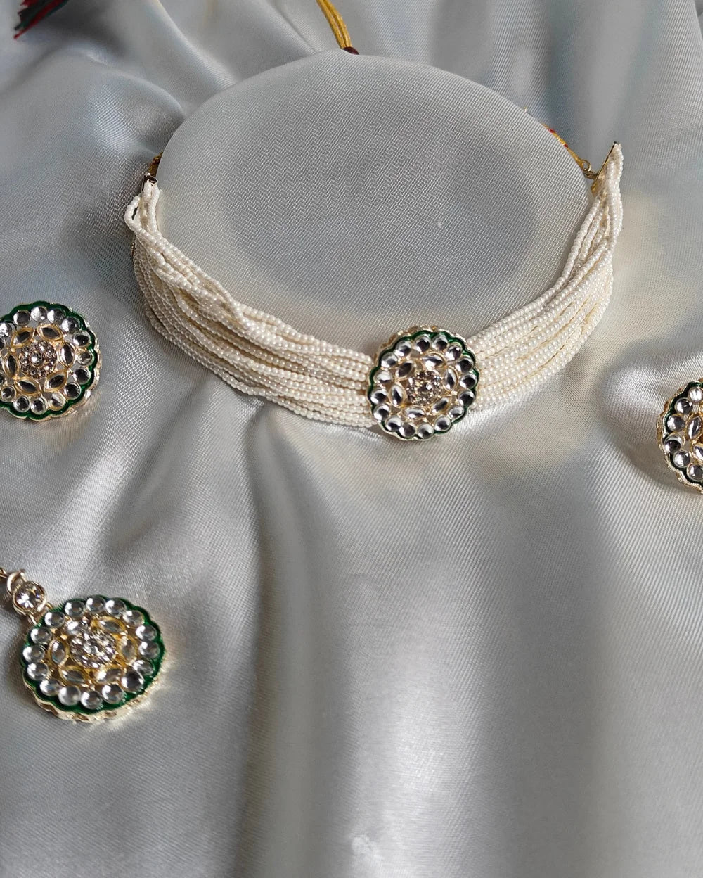 An Indian Ethnic White and Green choker Set